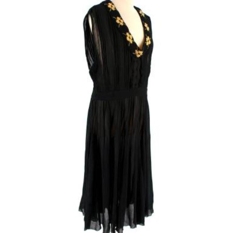 Prada Knit Trim Pleated Black Dress

- Light weight
- Yellow and black knit collar
- Pleated chiffon body
- Mid length 
- Sleeveless
- Side zip fastening

Materials:
This item does not have a care label, but we believe it to be a polyester