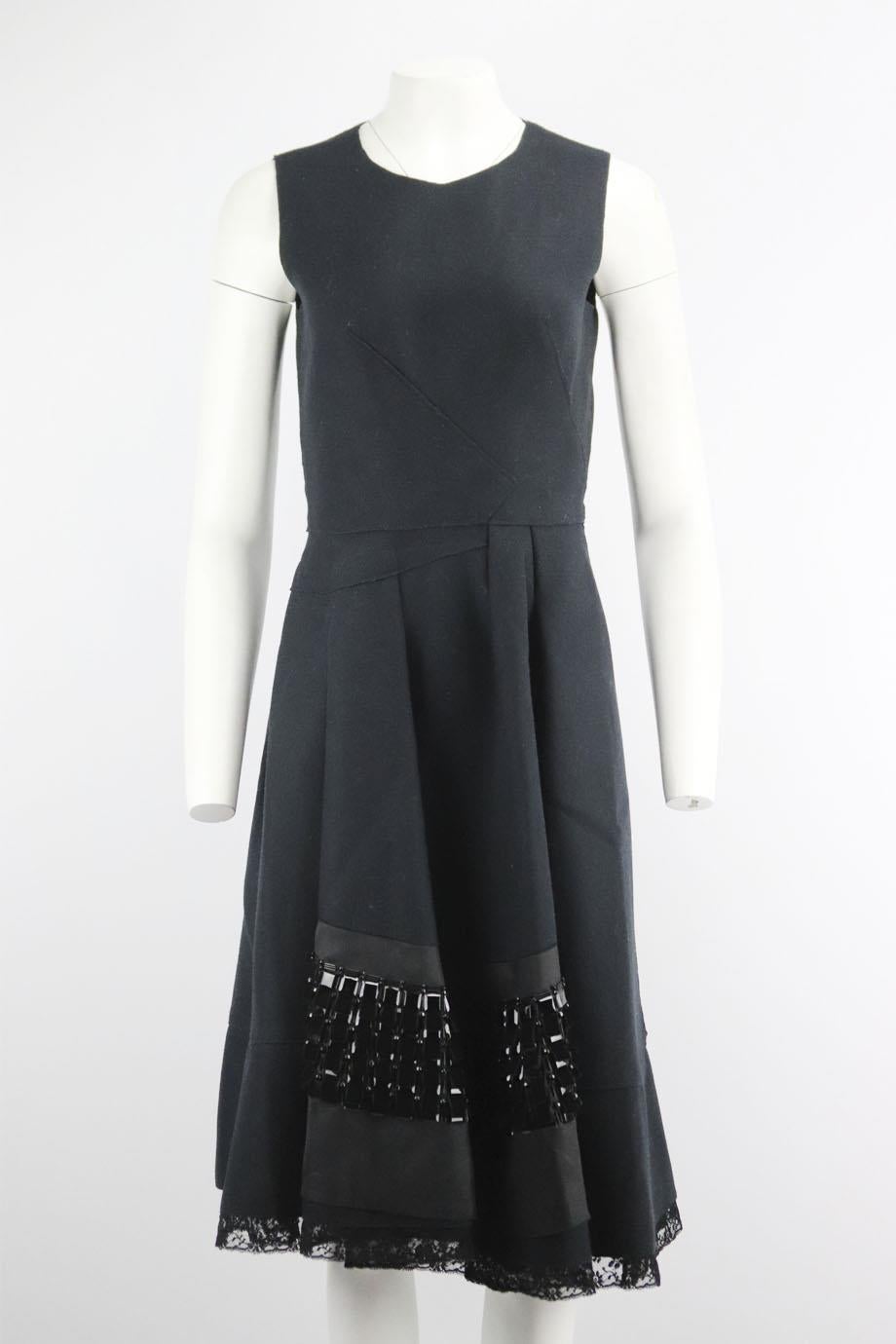 Prada lace trimmed embellished wool blend dress. Black. Sleeveless, crewneck. Zip fastening at back. 89% Wool, 11% polyamide. Size: IT 42 (UK 10, US 6, FR 38). Bust: 34 in. Waist: 27 in. Hips: 50 in. Length: 45 in
