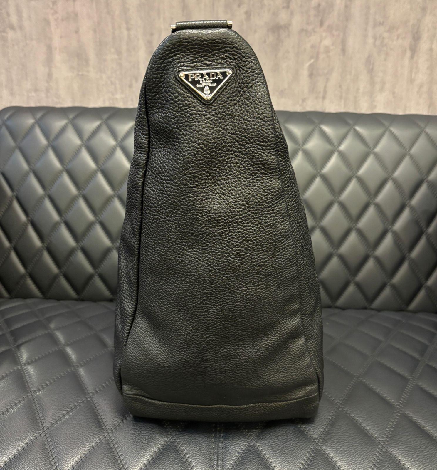 Unique prada large triangle bag in black. First seen in 2021 men’s collection. Very easy to wear bag, can be worn crossbody or shoulder. Without filling the bag is very supple and slouchy. Perfect travel bag. Overall in good condition with minor