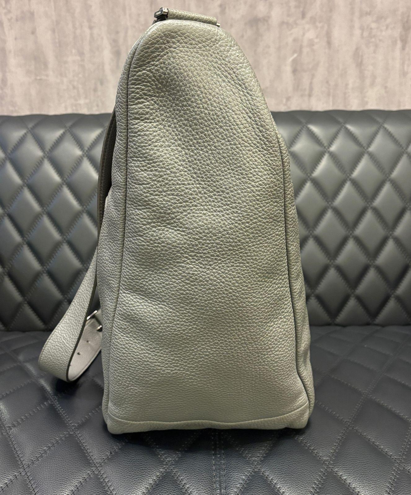 Unique prada large triangle bag in grey. First seen in 2021 men’s collection. Very easy to wear bag, can be worn crossbody or shoulder. Without filling the bag is very supple and slouchy. Perfect travel bag. Minor pen mark near the zip area but not