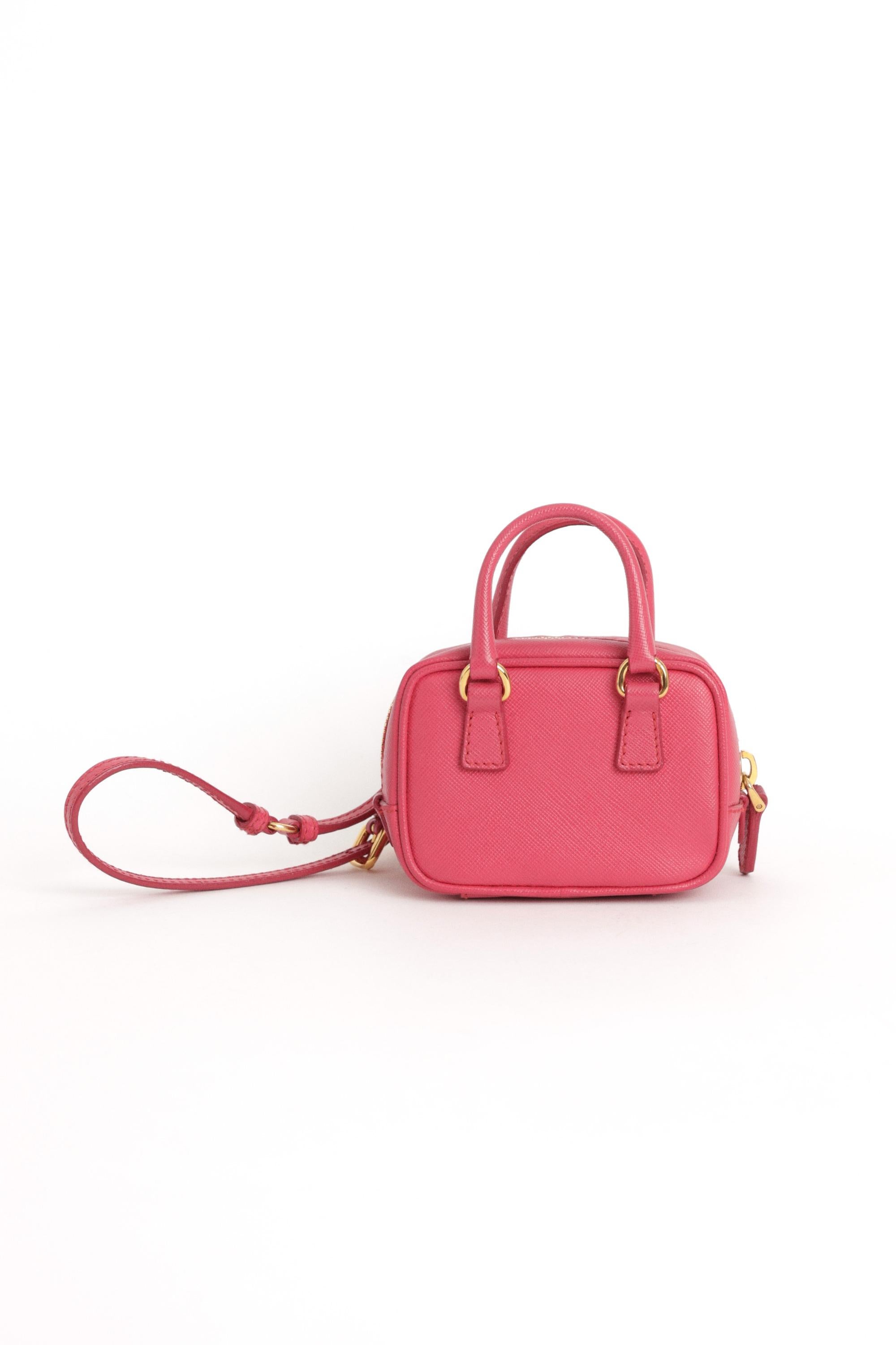We are excited to present this Prada 2010’s mini Tamaris bag. Features a hand strap, zip closure and removable cat keychain. Pre-loved, in excellent vintage condition. Please note, there is a small mark on the front - not noticeable.

Colour: Pink,