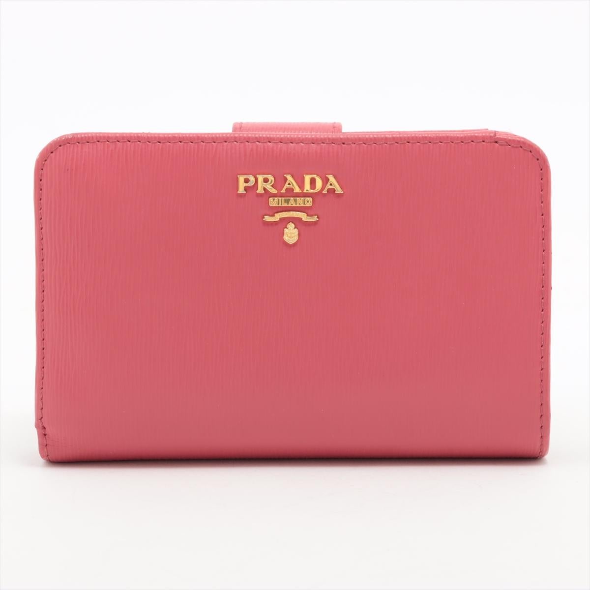 *ships around 11/11
The Prada Leather Bi-Fold Wallet in pink is a chic and sophisticated accessory that adds a pop of color to any ensemble. Crafted from premium leather, the wallet features a sleek bi-fold design that opens to reveal a thoughtfully