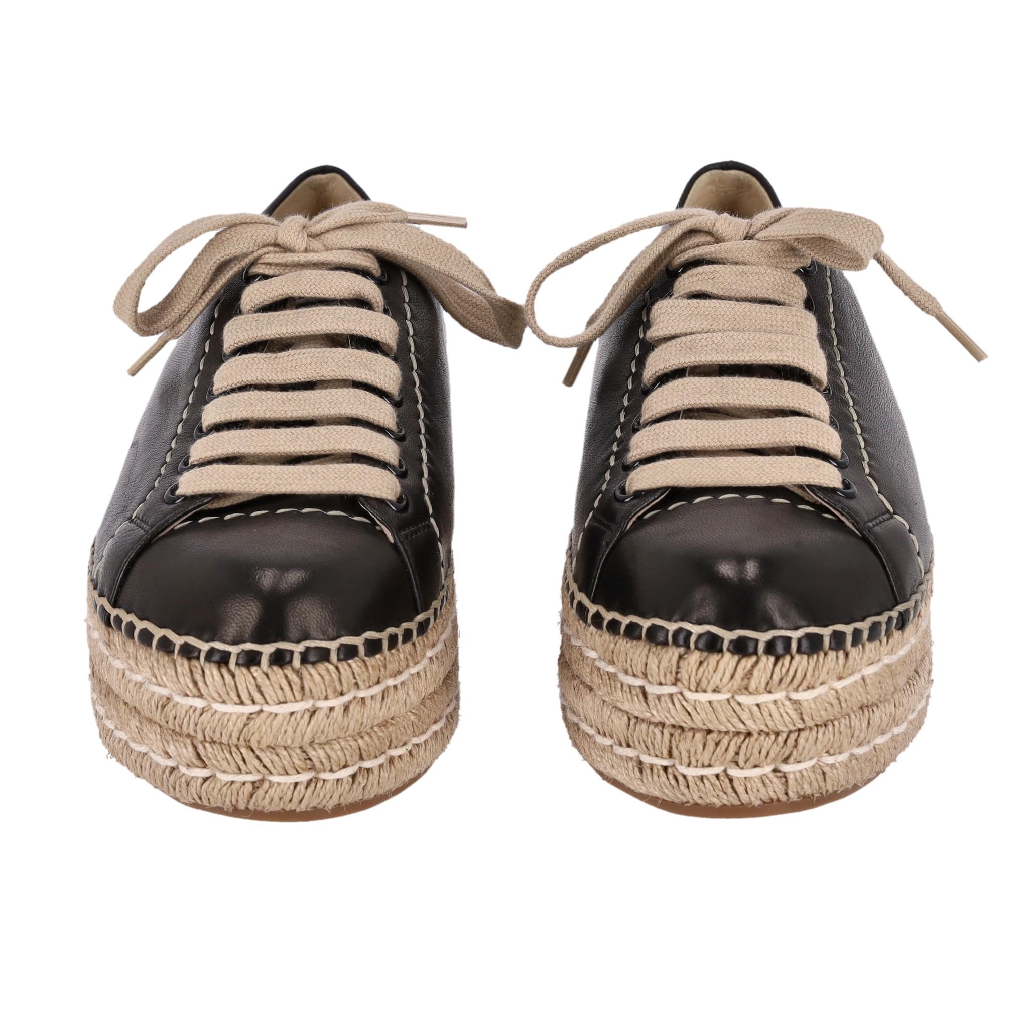 Prada Leather Espadrille Sneakers

Black leather sneakers designed with espadrille platform.

Featuring lace-up front, round toe and leather lining.

Rrp. Approx. £510

Size – 36.5

Condition – Very Good (Some scratches, slightly visible glue to the