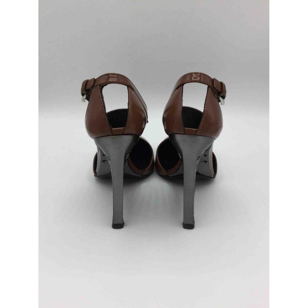 Black Prada Leather Heels in Brown For Sale