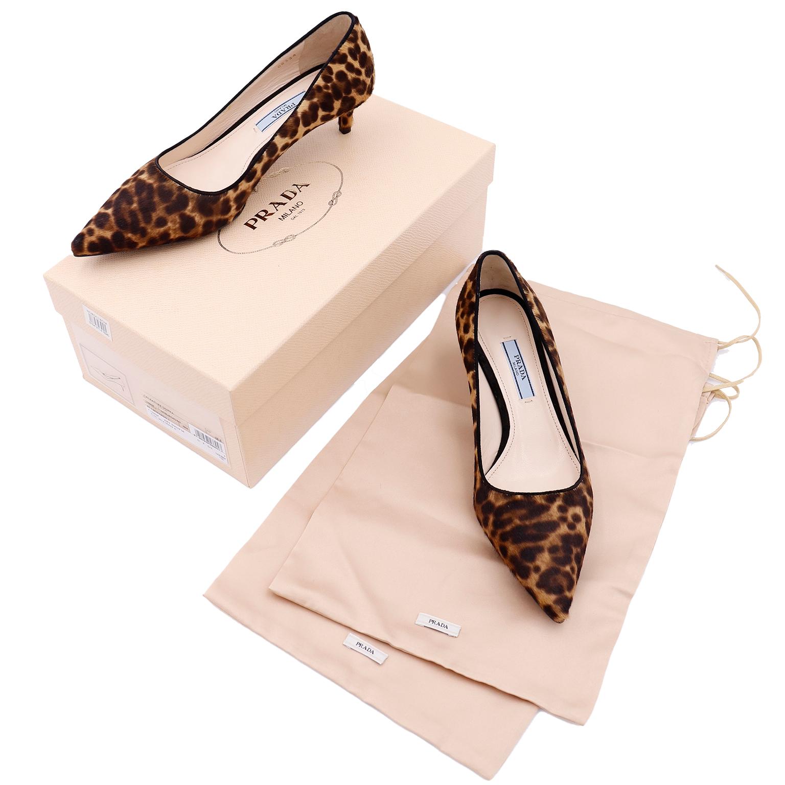 These are fun Prada leopard print pony fur kitten heels with black trim around foot opening and a pointed toe. These shoes appear to be unworn and come with their original box and shoe bags.
Labeled Prada Milano Made in Italy DAL 1913

Marked a size