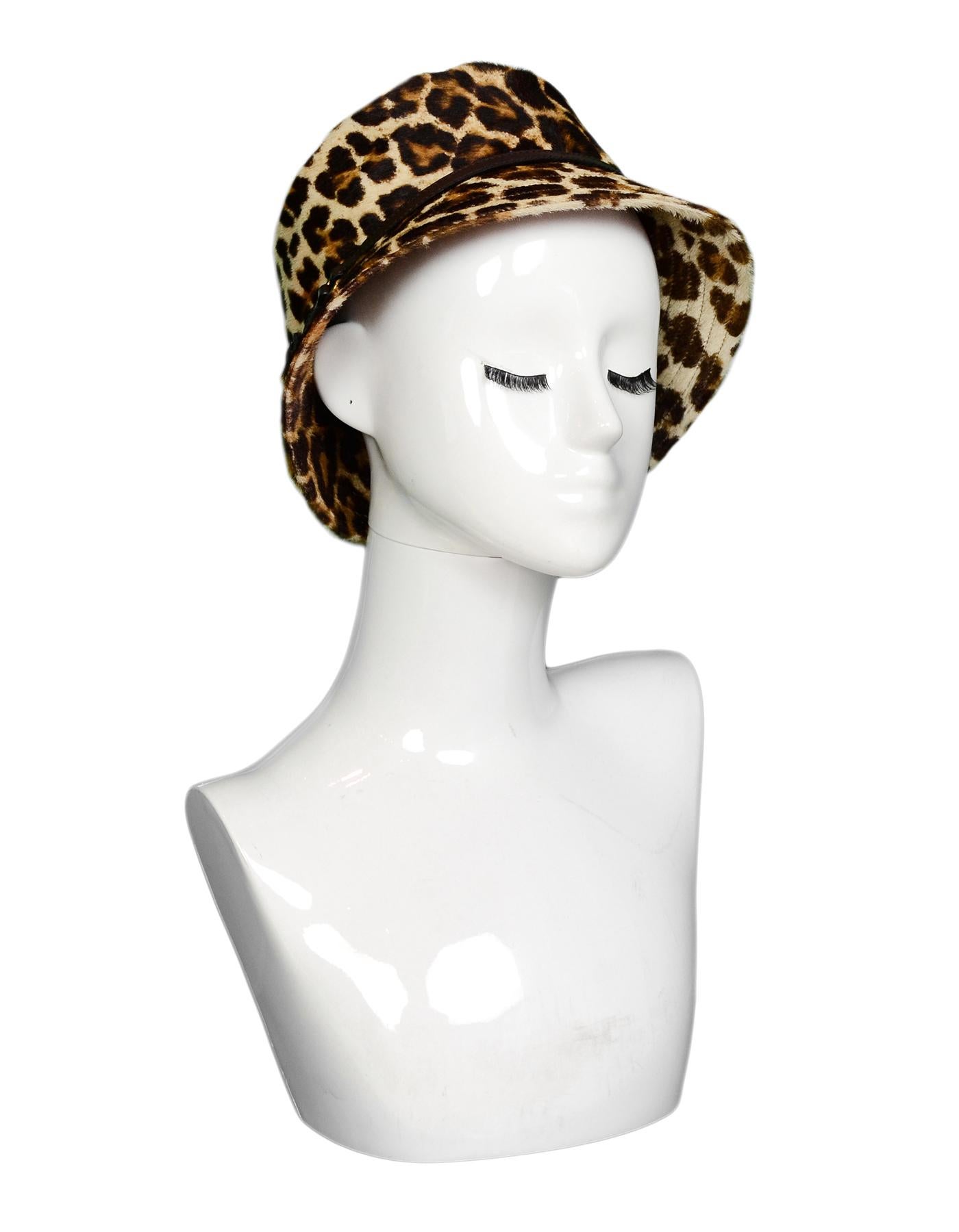 Prada Leopard Print Pony Hair Bucket Hat W/ Leather Trim Sz M

Made In: Italy
Color: Brown, tan
Hardware: Goldtone and gunmetal
Materials: 100% dyed calfskin fur, trim- 100% leather 
Lining: 100% nylon
Closure/Opening: Pull on
Overall Condition: