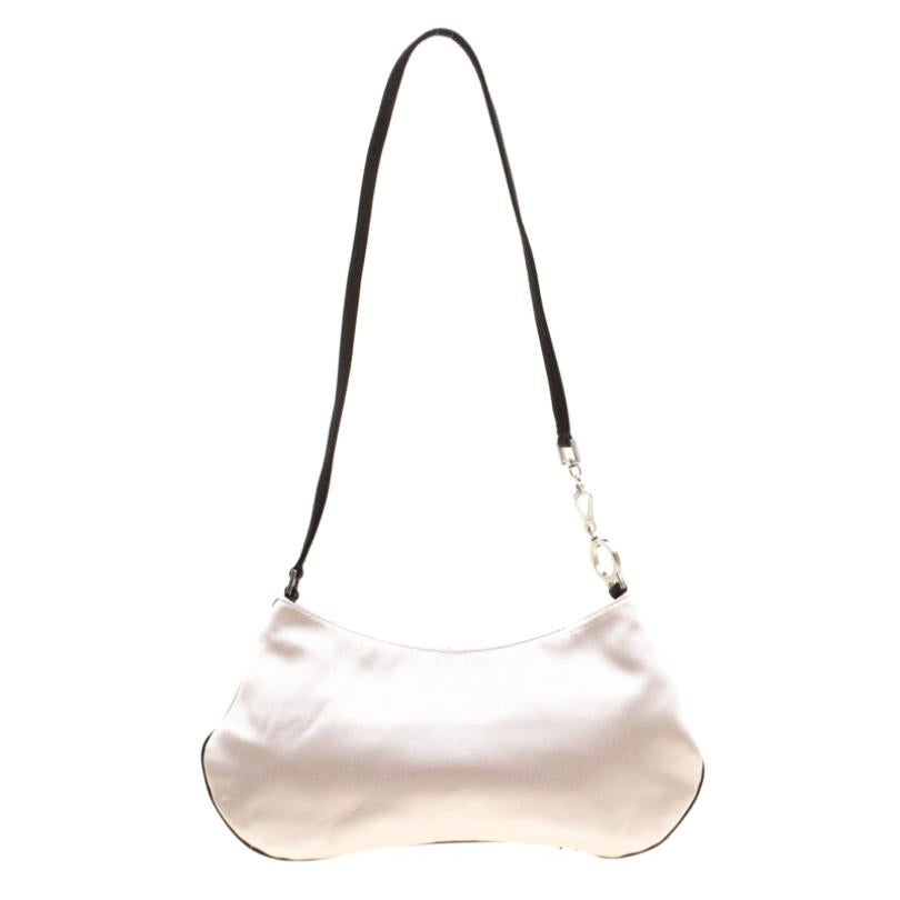 Perfect to swing everywhere, this bag from Prada is a must-have! Crafted from embroidered satin, the bag features a shoulder strap and a satin-lined interior for you to carry your essentials in.

Includes: Original Dustbag

