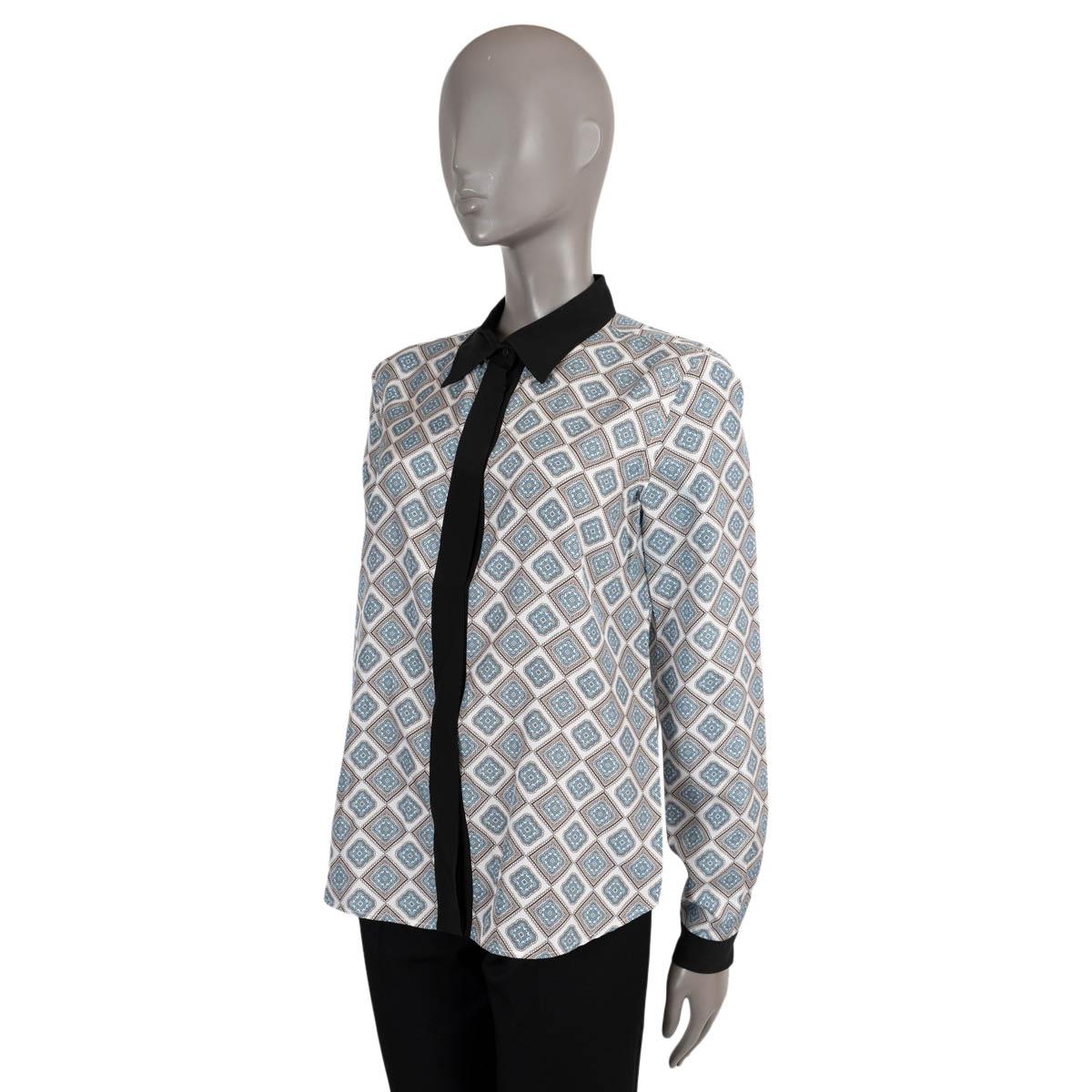 100% authentic Prada blouse in ivory, light blue and black silk (100%). Features a geometric print and contrast black collar, cuffs and button placket. Has been worn and is in excellent condition. 

Measurements
Tag Size	42
Size	M
Shoulder