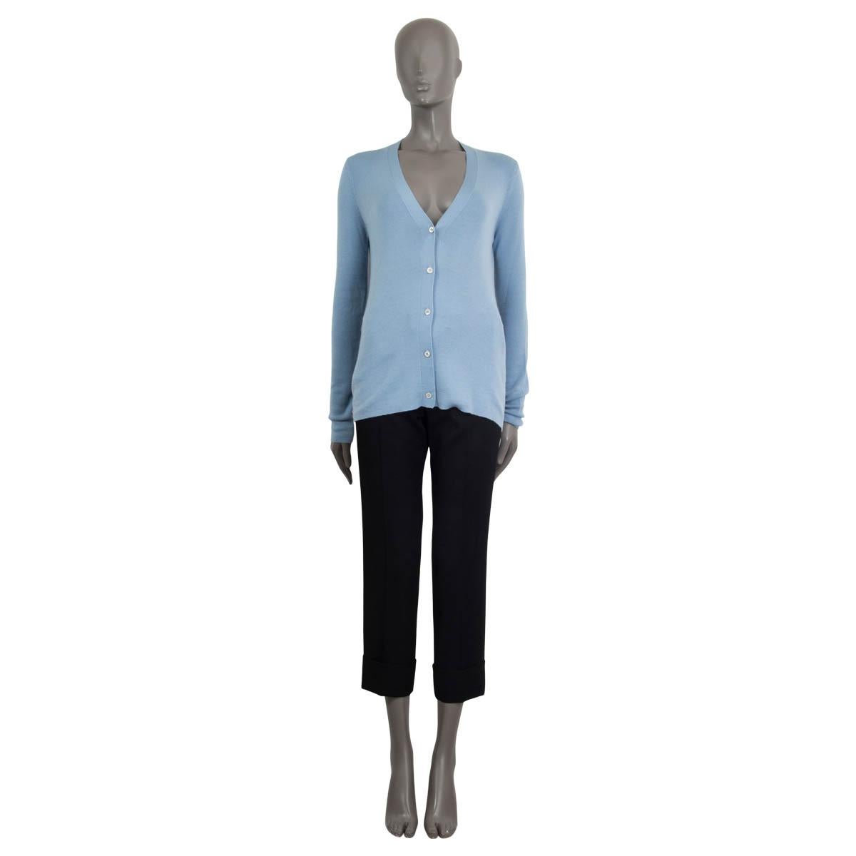 100% authentic Prada cardigan in light blue cashmere (70%) and silk (30%). Comes with a v-neck and opens with five plastic buttons on the front. Unlined. Has been worn and is in excellent condition. 

Matching sleeveless sweater available in