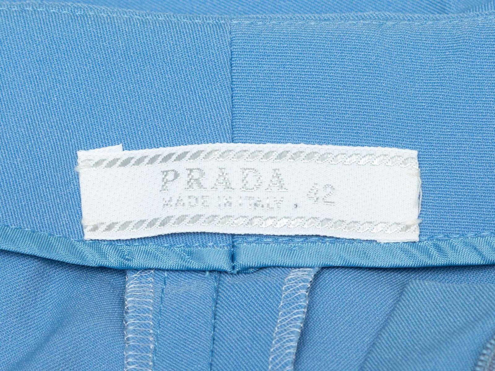 Product Details: Light blue nylon straight-leg pants by Prada. Designer size 42. 28