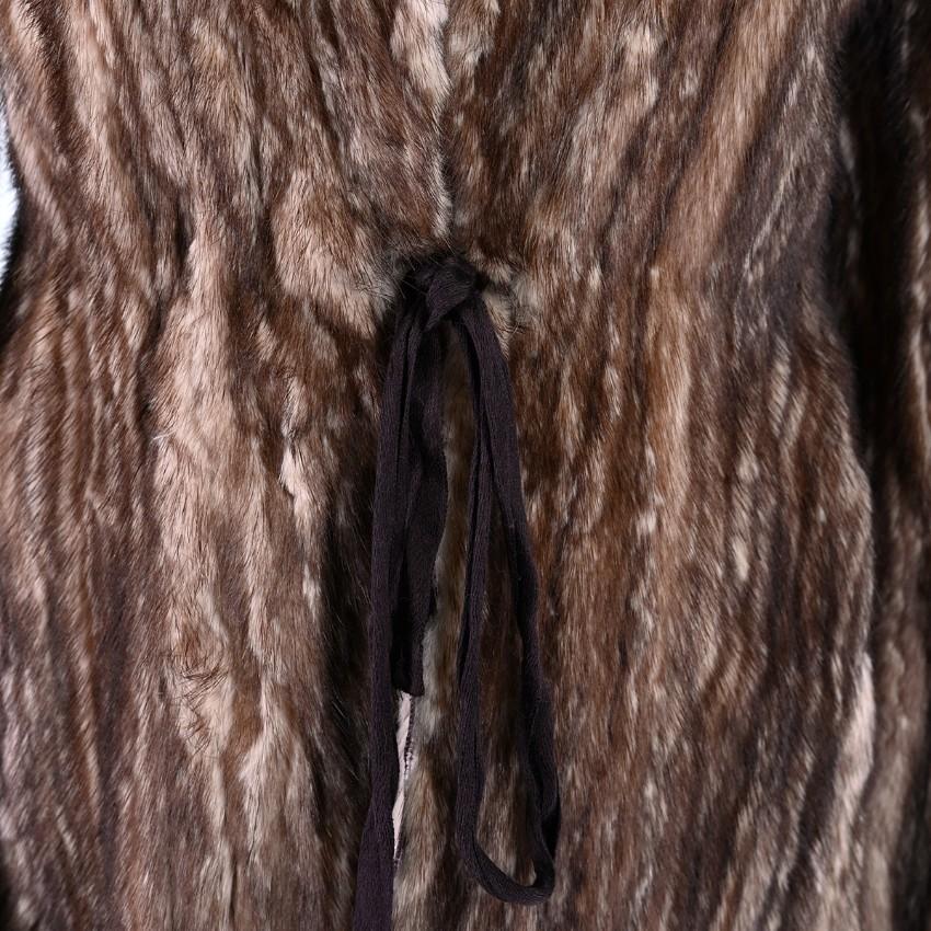 Prada Light Brown Mink Fur Self-Tie Waist Jacket

- FW 2002 Runway Collection
- Funnel neckline with raw unfinished opening
- Cut to fit slim on the body - Tonal self-tie cinching the waist
- Hidden pockets sit on each hip
- Fully lined with sheer