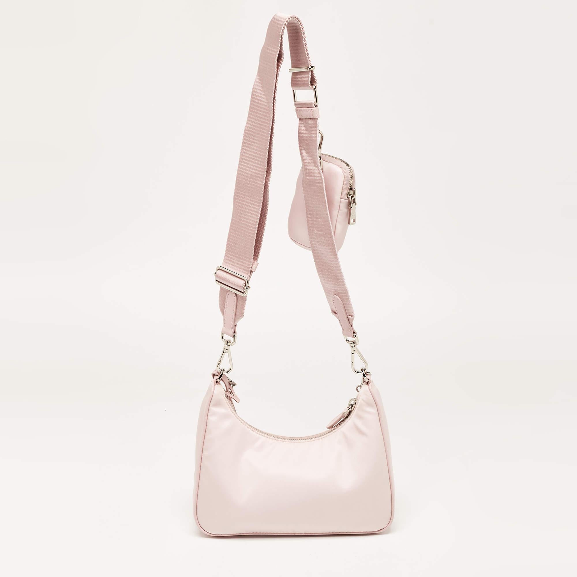 This Prada Re-Edition 2005 baguette bag is an example of the brand's fine designs that are skillfully crafted to project a classic charm. It is a functional creation with an elevating appeal.

Includes: Extra Pouch, Original Dustbag, Original Box,