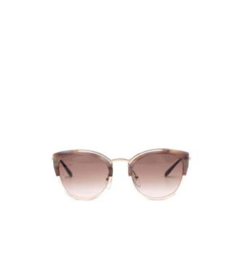 Prada Lilac Acetate & Gold-Tone Metal Cat Eye Sunglasses

- Cat-eye shape with lilac hued acetate top
- Brown lens

Material:
Acetate 

Made in Italy 

9/10 very good condition, with minor signs of wear on the corner of the left lens. Please use