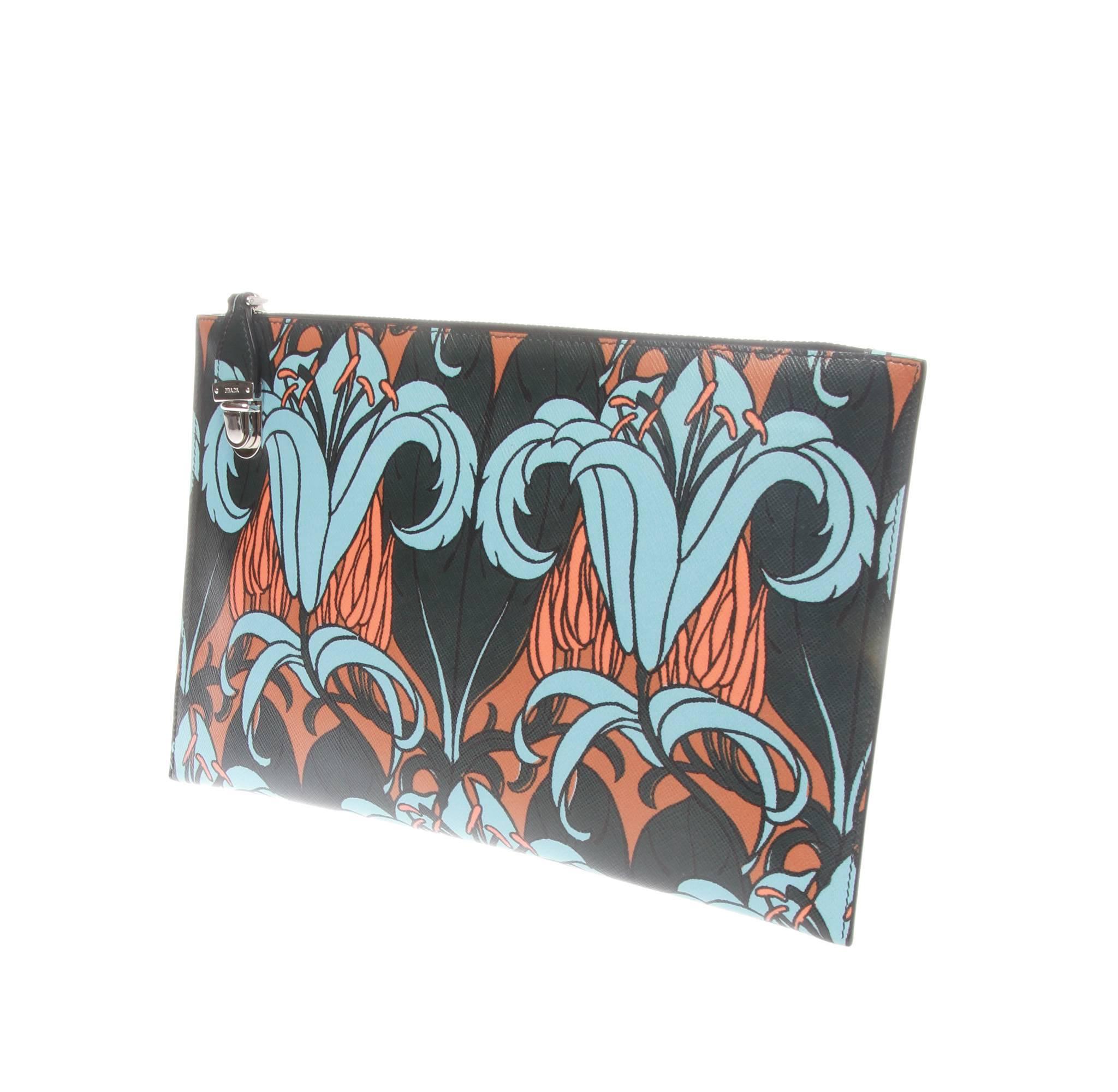 Prada leather pouch, clutch or document holder featuring a lily print graphic. One main compartment with zip at top and and push lock closure/security mechanism. Handheld strap at back. 

Comes with box and dustbag.
