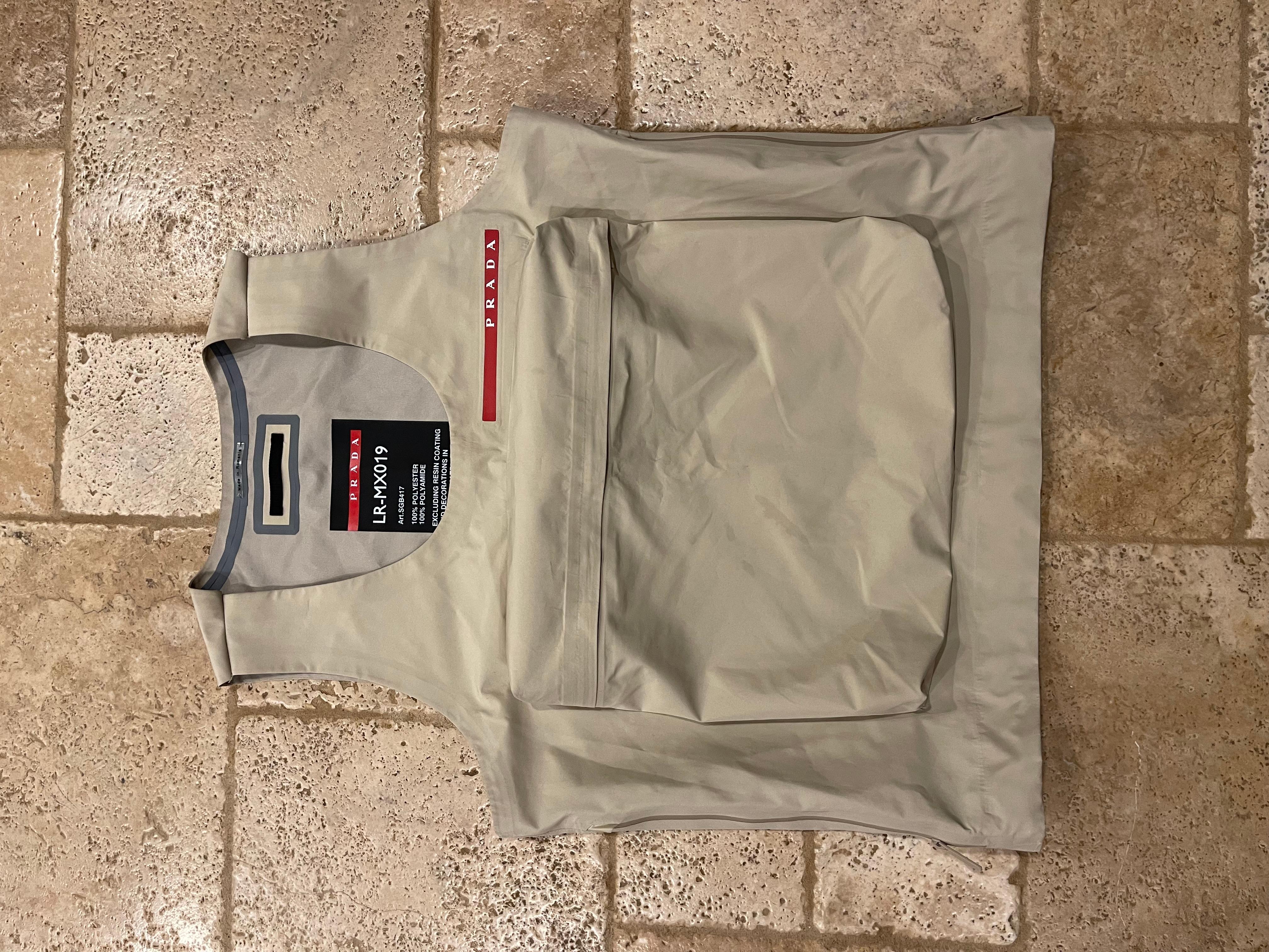 Prada Linea Rossa Cargo Pocket Tan/Beige Vest
Size small (could fit S-L; see measurements)
Great condition (has small stains on hoodie that could be removed easily with a simple dry clean. See detailed pics)
Very rare and sought after vest. You will