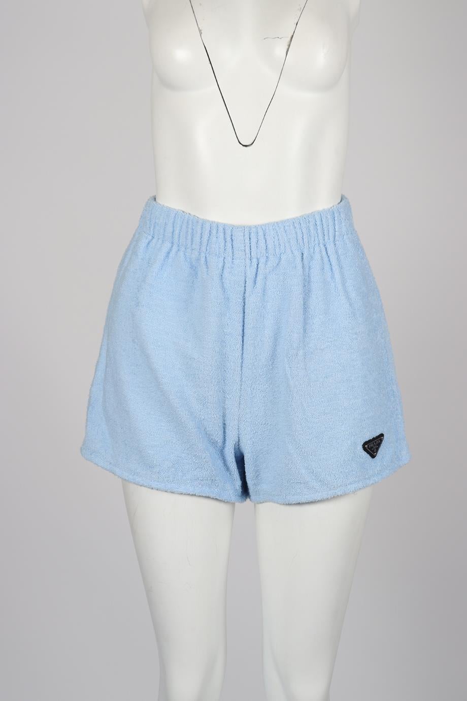 Prada Logo Detailed Terry Cloth Shorts. Blue. Pull on. 100% Cotton; fabric2: 100% reycled polyamide. IT 38 (UK 6, US 2, FR 34). Waist: 25 in. Hips: 34 in. Length: 14 in. Inseam: 2.6 in. Rise: 13.4 in. Condition: Used. Very good condition - No sign