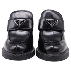 Prada Logo Heeled Loafers in Black Leather