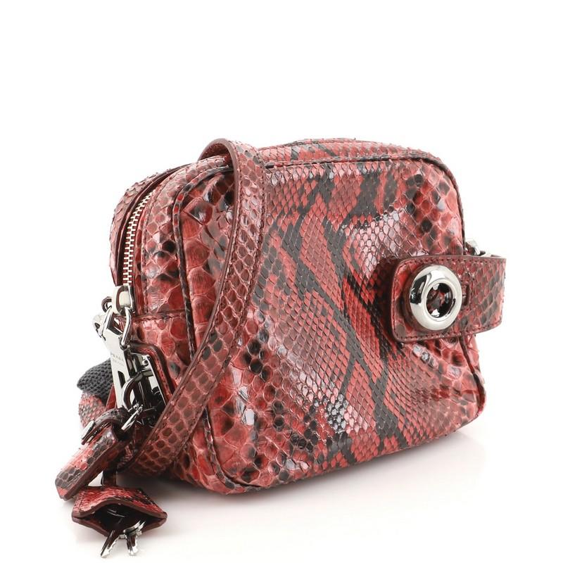 This item can only be shipped within the United States.

Condition: Very good. Odor in interior. Creasing and moderate lifting on scales on exterior and strap, minor scuffs in interior, scratches on hardware.
Accessories: Keys, Lock, Clochette, With