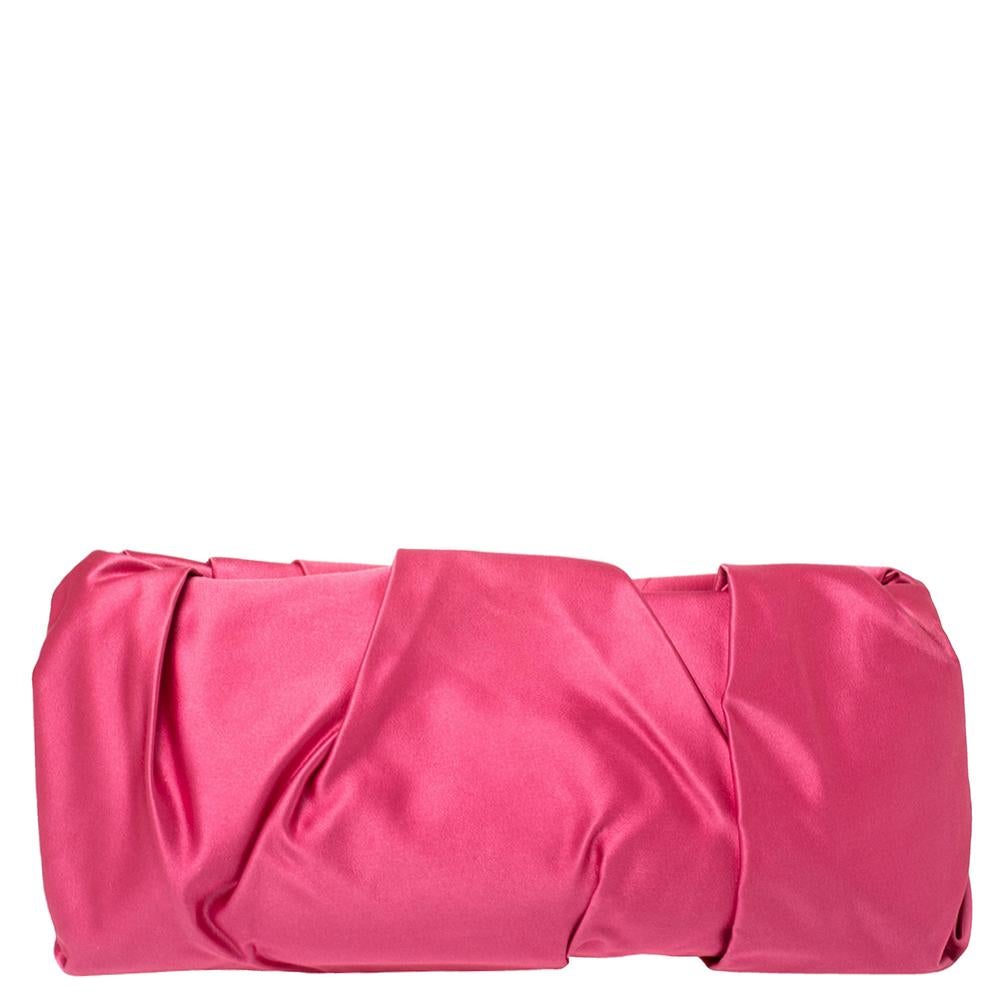The perfect accessory on a night out, this Prada Raso clutch is elegant and stylish. The pleated satin exterior features brand detailing in gold-tone hardware. This clutch opens up to a satin-lined interior with a card slot.

Includes: Authenticity