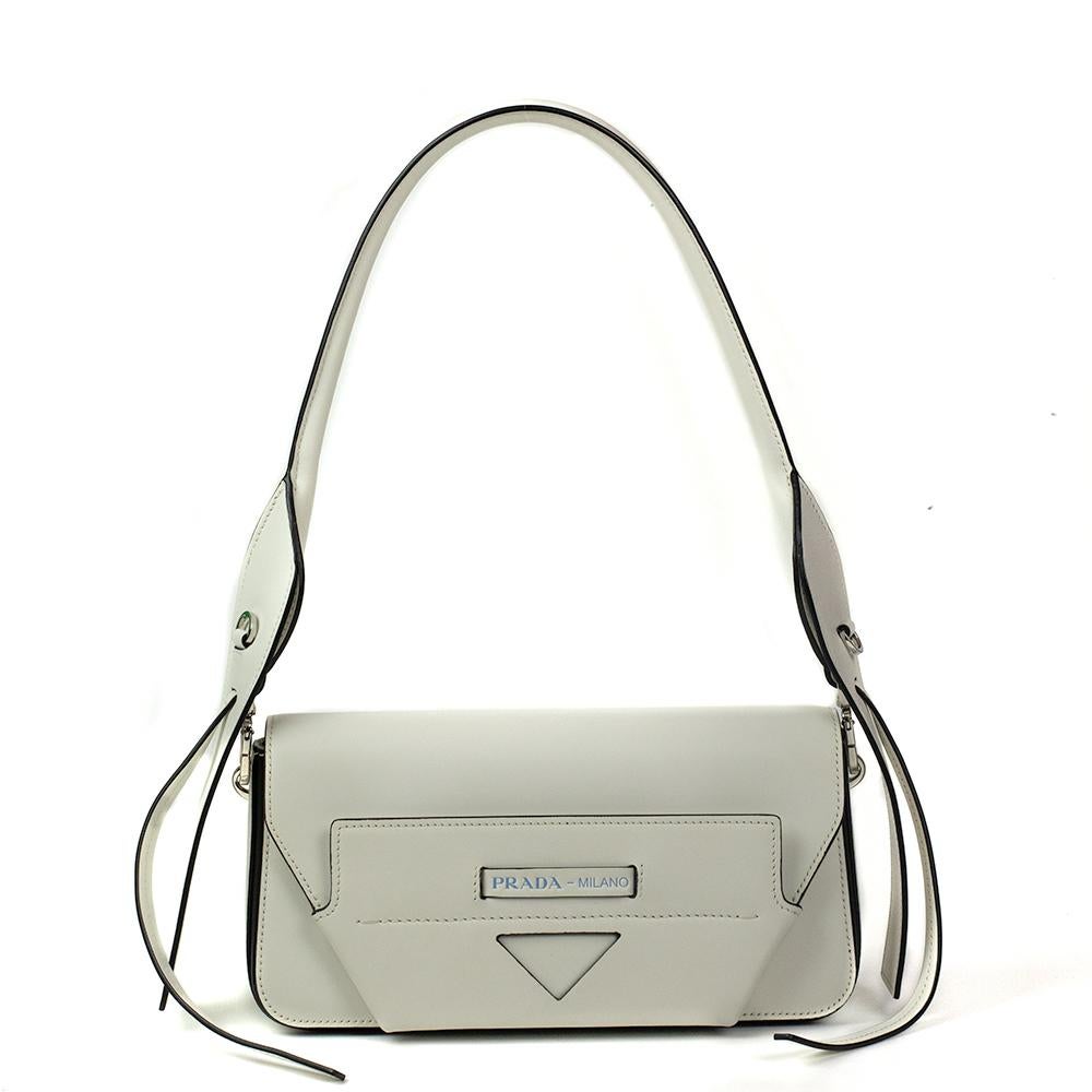 - Designer: PRADA
- Model: Manuelle
- Condition: Very good condition. Sign of wear on 1 base corner
- Accessories: Dustbag, Authenticity Card
- Measurements: Width: 25cm, Height: 10cm, Depth: 7cm, Strap: 100cm
- Exterior Material: Leather
- Exterior