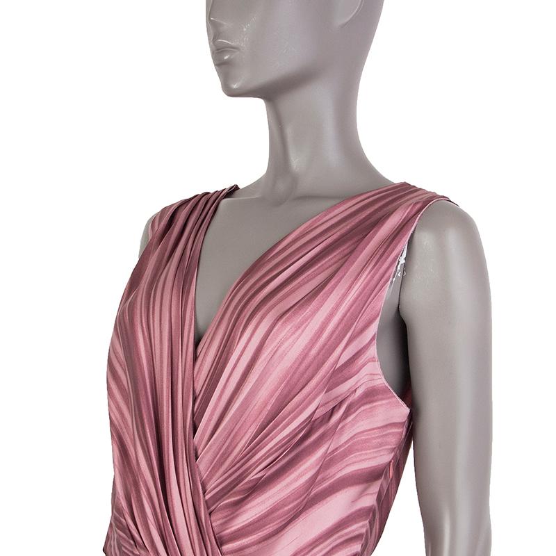 Prada flared drape-print in mauve and off-white silk (100%). With pleated shoulders, wrap top, and pleated skirt. Closes with invisible zipper on the side. Unlined. Has been worn and is in excellent condition. 

Tag Size 42
Size M
Bust From 96cm