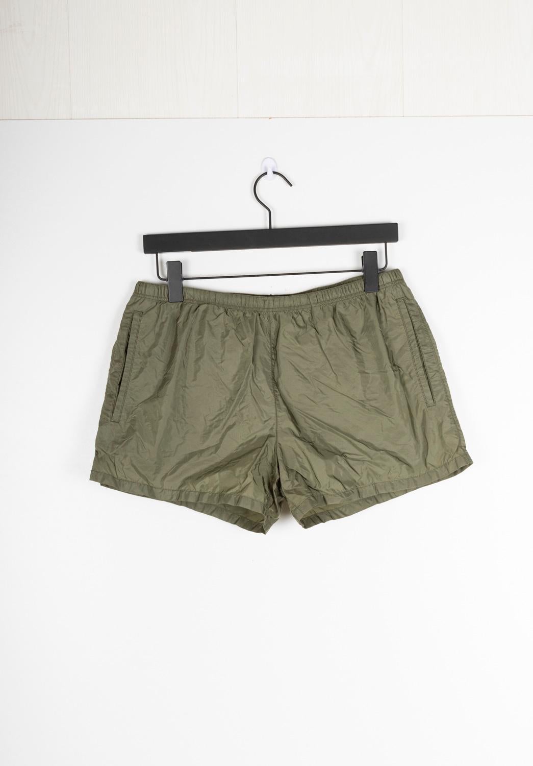 100% genuine Prada Swimming Men Shorts, S1348, KE7
Color: khaki
(An actual color may a bit vary due to individual computer screen interpretation)
Material: 100% polyamide
Tag size: IT52 - Large
These shorts are great quality item. Rate 9 of 10,