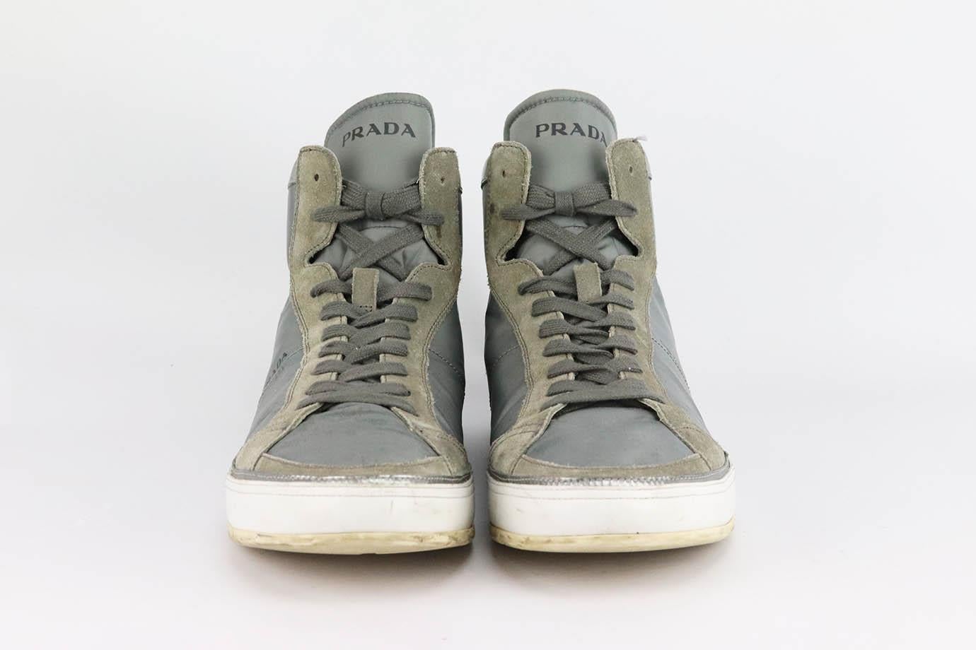 These high-top sneakers by Prada is just as cool as the last - they're made from breathable suede, leather and nylon and have padded collars and logo on the back. Rubber sole measures approximately 25 mm/ 1 inches. Grey nylon, grey suede, silver