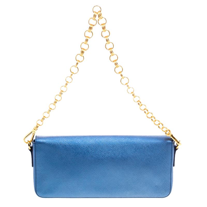 When you need to add a beautiful and elegant bag to your evening look, this Prada shoulder bag will look chic as well as hold your essentials. Crafted in metallic blue saffiano lux leather, this bag is perfect for those special evenings and even day