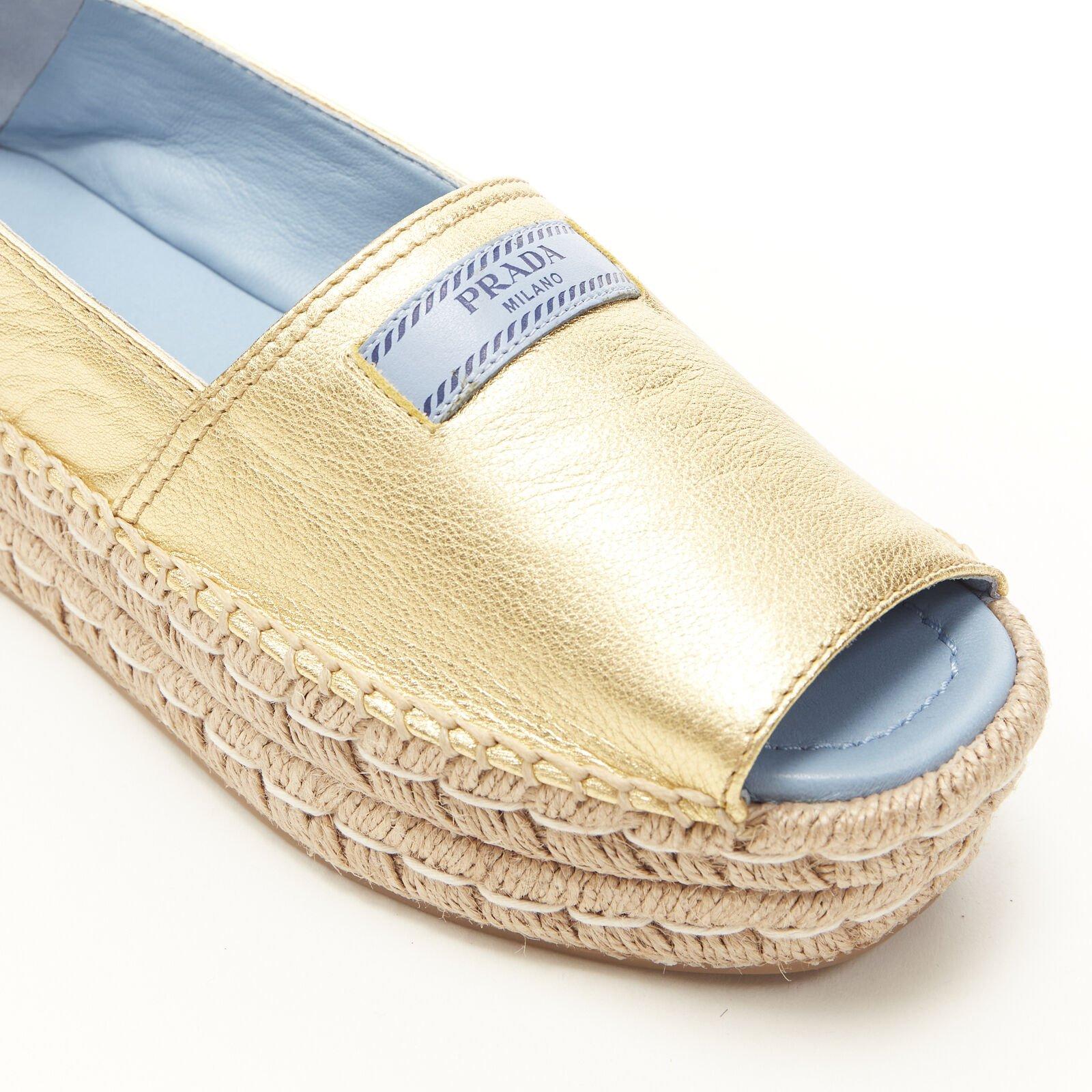 PRADA metallic gold leather logo peep jute platform espadrille shoe EU38.5
Reference: TGAS/B00428
Brand: Prada
Designer: Miuccia Prada
Material: Leather, Jute
Color: Gold
Pattern: Solid
Lining:  Leather
Extra Details: Signature Prada dual platform