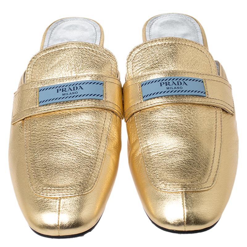 From Prada comes this pair of dazzling mules that will exude luxury at each step. Crafted from leather, these metallic gold mules feature round toes, the logo on the uppers and sturdy outsoles.

Includes: The Luxury Closet Packaging

