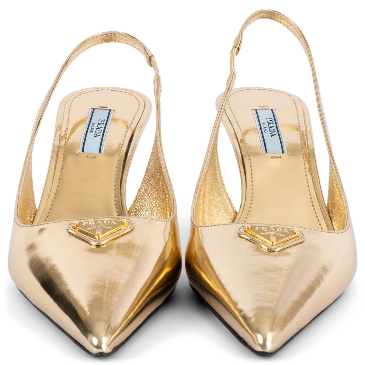 100% authentic Prada pointed-toe slingbacks in gold-tone metallic leather with logo plaque. Brand new.

Measurements
Imprinted Size	37
Shoe Size	37
Inside Sole	24cm (9.4in)
Width	7.5cm (2.9in)
Heel	7cm (2.7in)
Hardware	Gold-Tone

All our listings