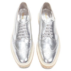 PRADA metallic silver leather perforated leather jute rubber sole brogue EU40