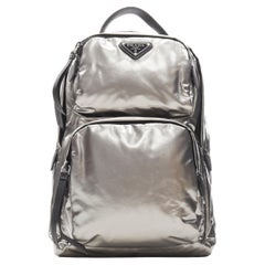 PRADA metallic silver triangle logo small sling backpack bag