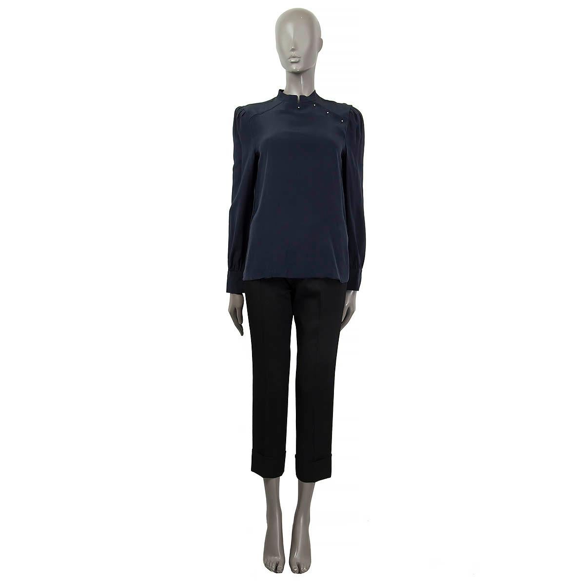 100% authentic Prada high collar long sleeve blouse in midnight blue silk (assumed cause tag is missing). Features a self tie bow at the back neck and buttoned cuffs. Opens with four buttons at the neck. Unlined. Has been worn and is in excellent