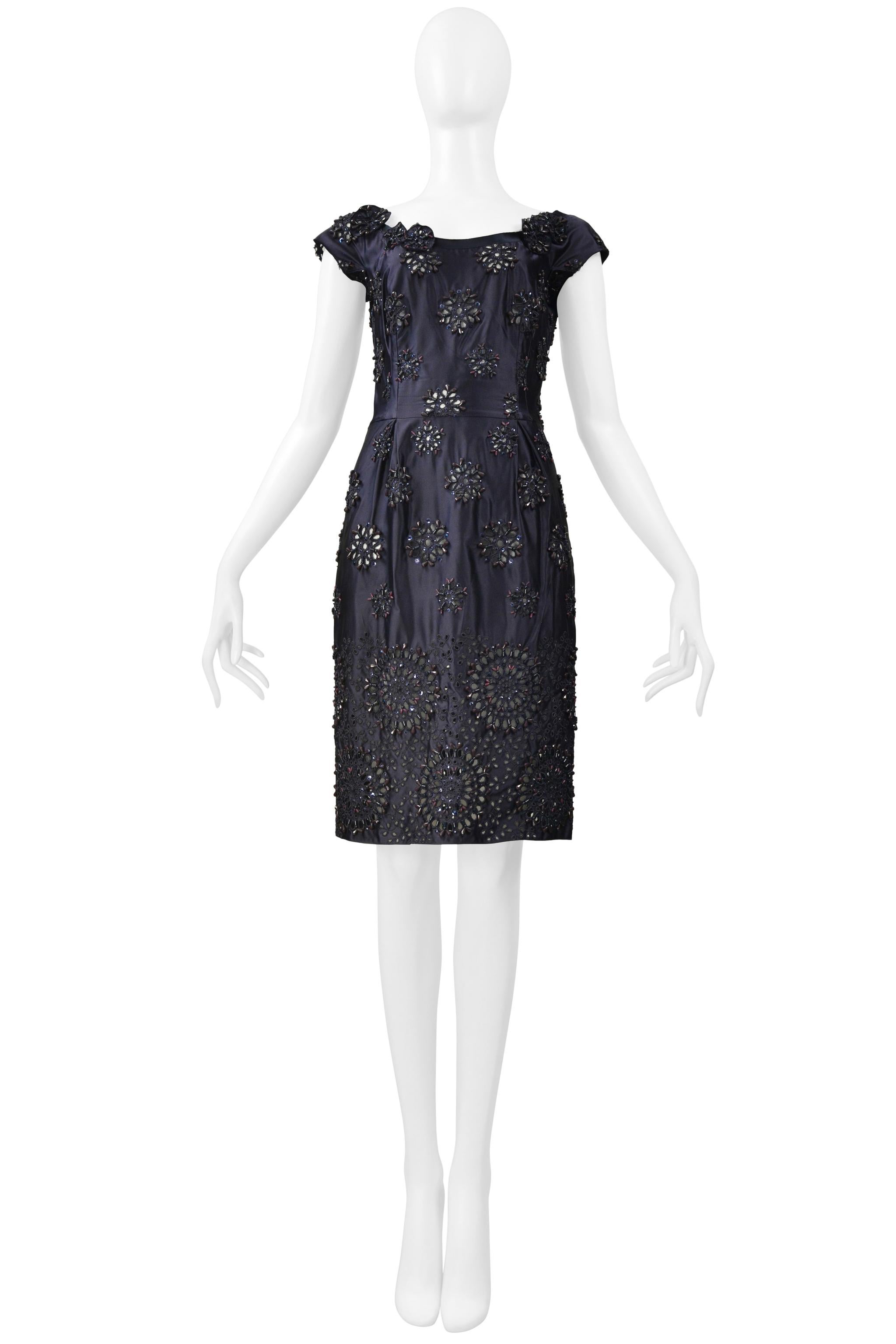 Resurrection Vintage is thrilled to offer a classic vintage Prada dark midnight blue taffeta dress featuring intricate floral-shaped embroidery and beading, laser cuts, cap sleeves, center back zipper closure, and knee-length. 

Prada

Size: Missing