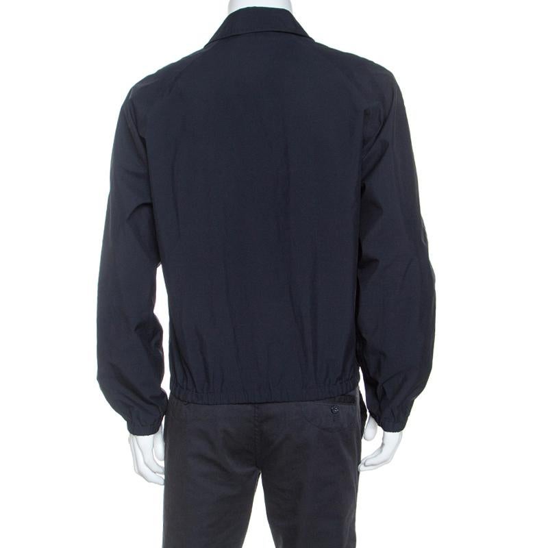 This stunning jacket by Prada is a must-have. Created form quality fabric, this jacket flaunts a lovely shade of midnight blue. It has been cut to deliver a good fit and comes with a collared neck, long sleeves and front zip. This Harrington jacket