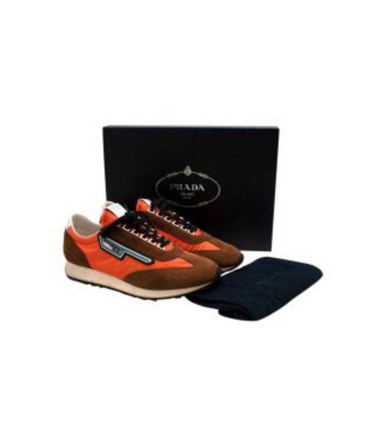 Prada Milano 70 Rubber and Leather-Trimmed Nylon Sneakers

- Durable orange nylon
- Tan suede outline
- Blue rubberized logo
- Branded tongue
- White eyelets 
- Black laces

Material
Leather, Nylon, and Rubber sole

Made in Italy

9.5/10 Excellent