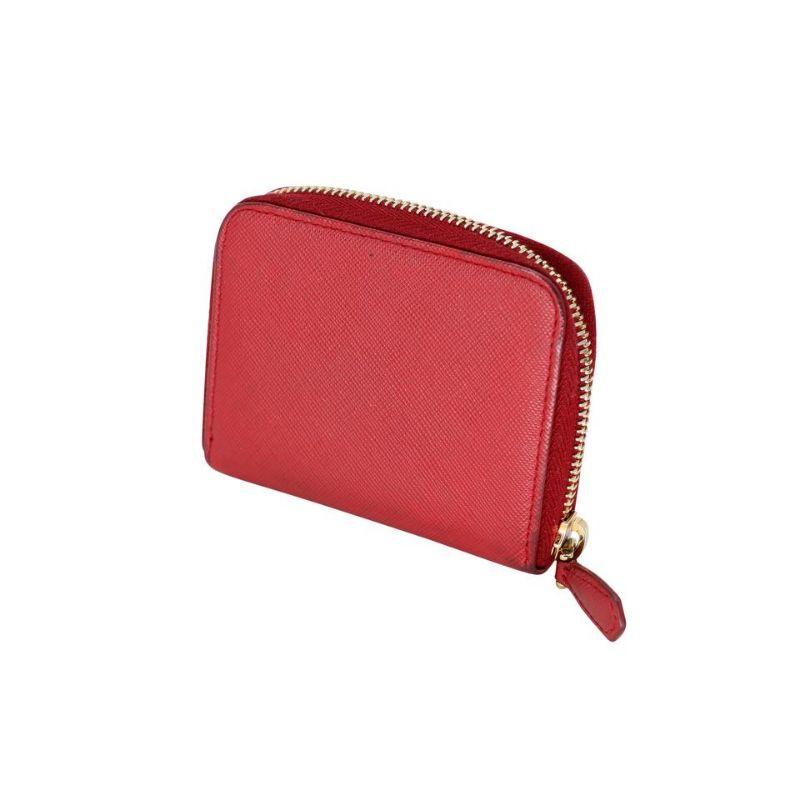 Prada Milano Saffiano Leather Travel Wallet PR-1202p-0003

This cute and sophisticated small Prada Saffiano travel coin pouch features a durable Saffiano leather and gold-tone hardware accents with a zip around closure. It will hold all your
