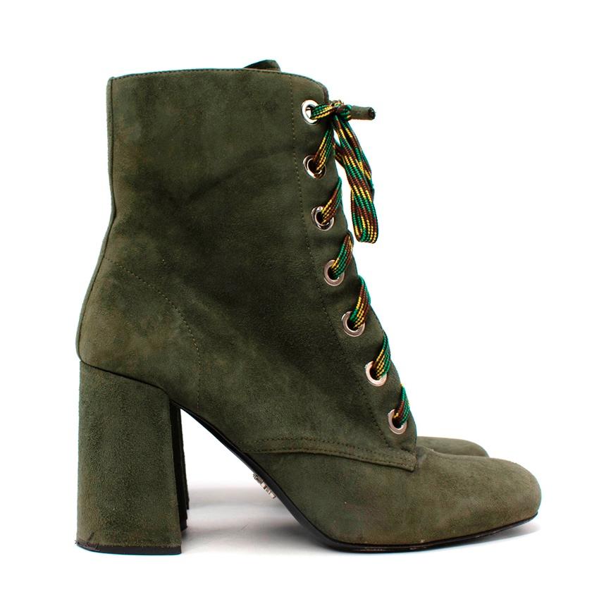 Prada Ankle Boots In Military Green 
 

 -Suede body
 -Solid color, 
 -Zip closure, 
 -Round toe line
 -Geometric heel
 -Leather lining
 -Leather sole
 -Contains non-textile parts of animal origin
 -Soft Leather
 

 Materials 
 Leather 
 

 Made in