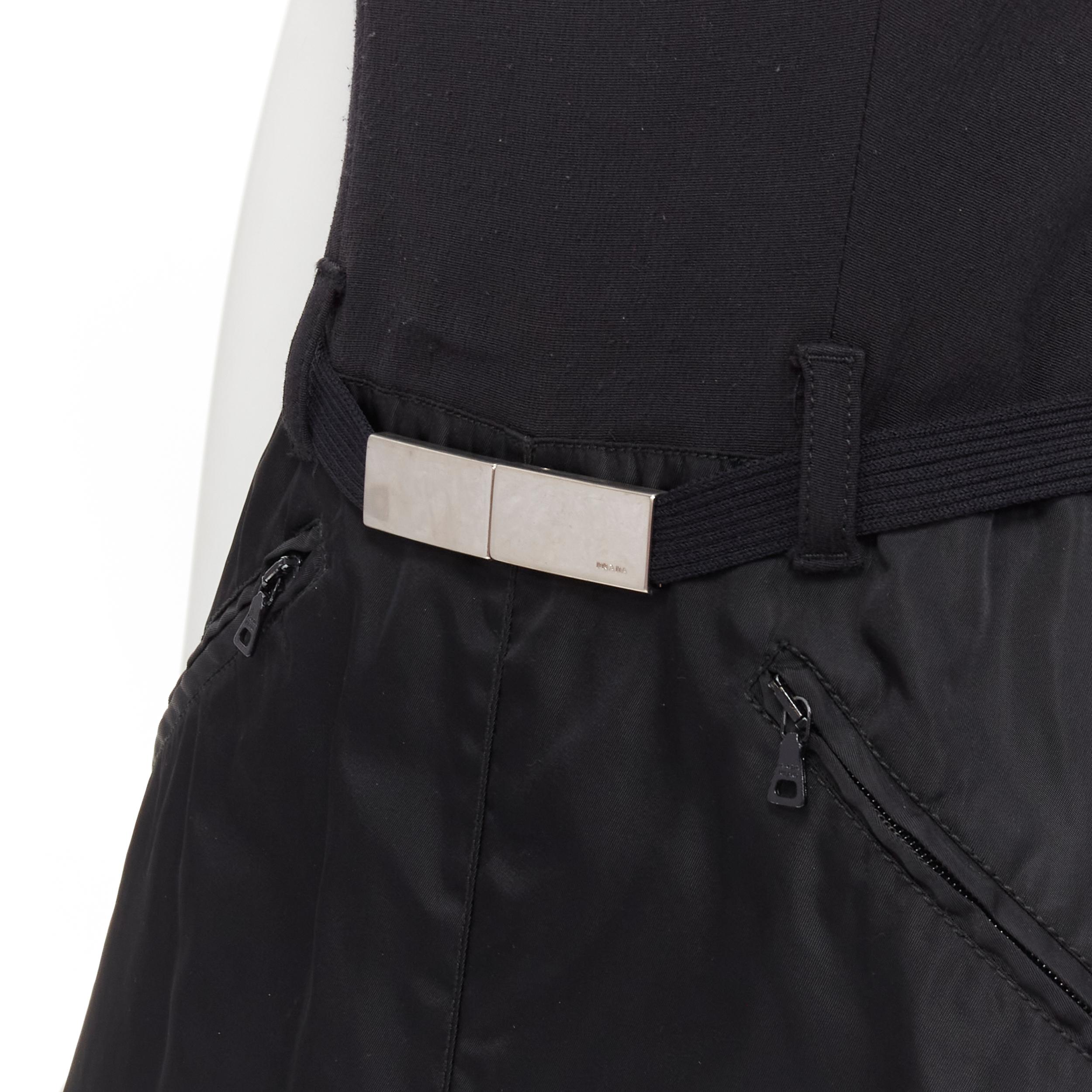 PRADA minimal black metal buckle belted nylon A-line skirt dress S 
Reference: GIYG/A00155 
Brand: Prada 
Designer: Miuccia Prada 
Material: Crepe 
Color: Black 
Pattern: Solid 
Closure: Zip 
Extra Detail: Black crepe upper. Ribbed metal buckle