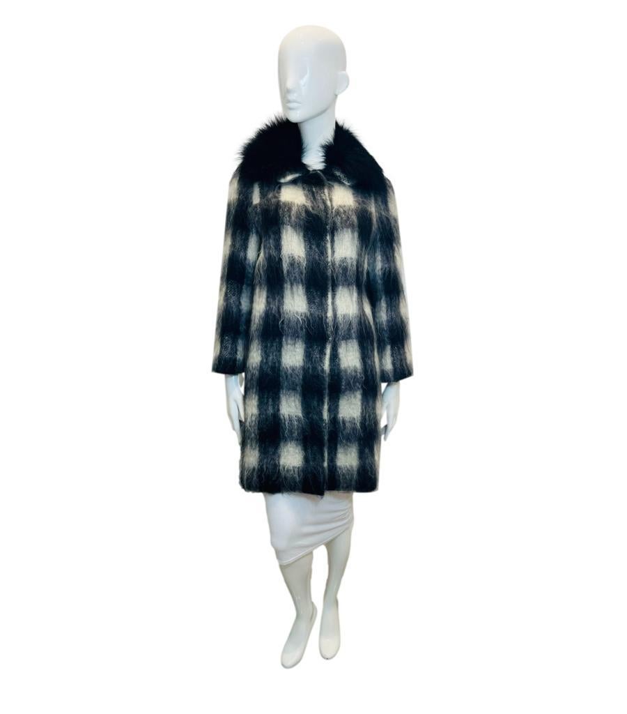 Prada Mohair & Wool Coat With Raccoon Fur Trim

Black and white coat designed with a large check pattern.

Detailed with black raccoon fur trimmed collar.

Featuring concealed snap closure to the centre.

Size – 40IT 

Condition – Very