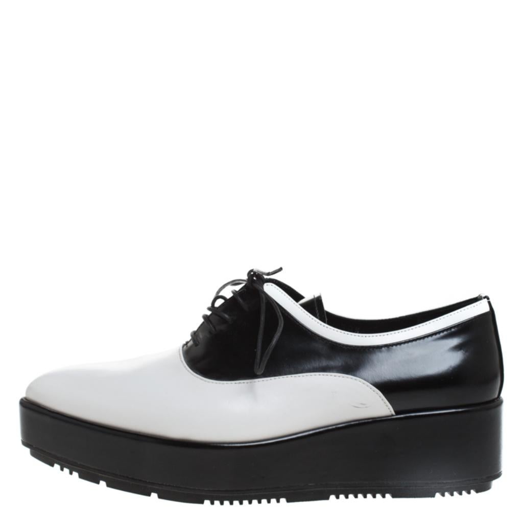 These oxford flats made from leather are exclusively crafted for you. They feature covered pointed toes, laces on the vamps and thick platforms. The monochrome shoes from Prada will lend a stylish edge to your outfits.

Includes: The Luxury Closet