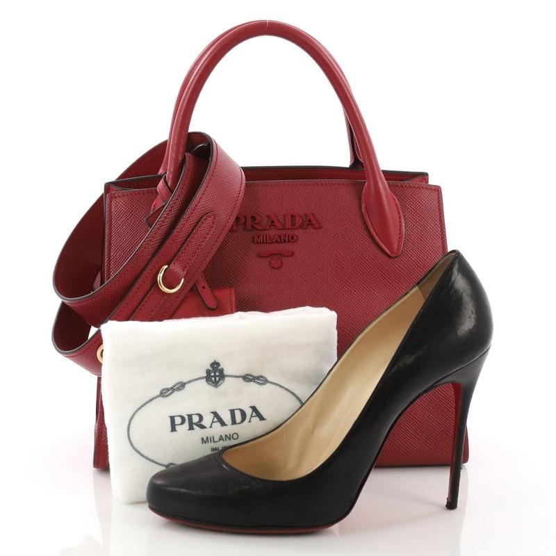 This Prada Monochrome Tote Saffiano Leather with City Calfskin Small, crafted from red saffiano leather with city calfskin leather, features dual rolled leather handles, Prada logo on front, and gold-tone hardware. It opens to a red fabric interior