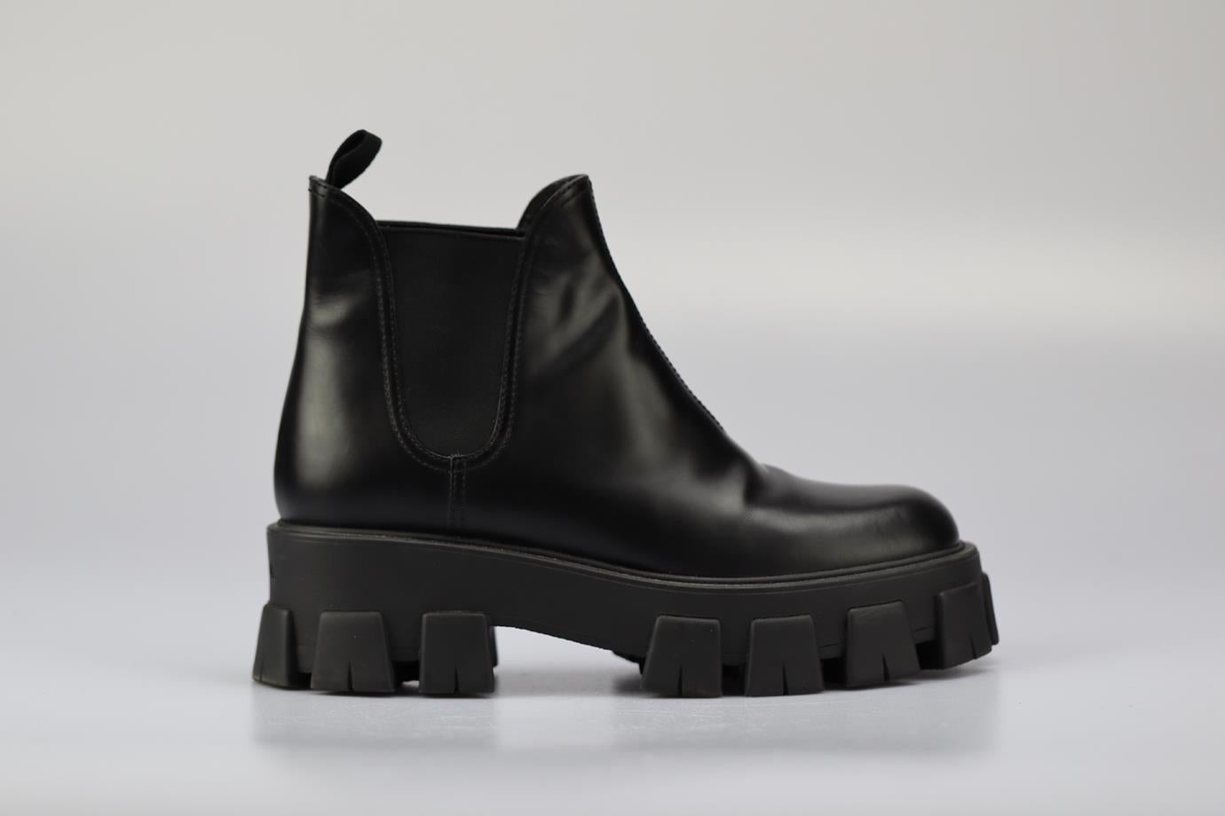 Prada Monolith Leather Platform Ankle Boots. Black. Pull on. Does not come with - dustbag or box. EU 40 (UK 7, US 10). Insole: 11.1 in. Heel height: 2.3 in. Platform: 2.3 in. Shaft: 5.3 in. Condition: Used. Very good condition - Light wear to soles