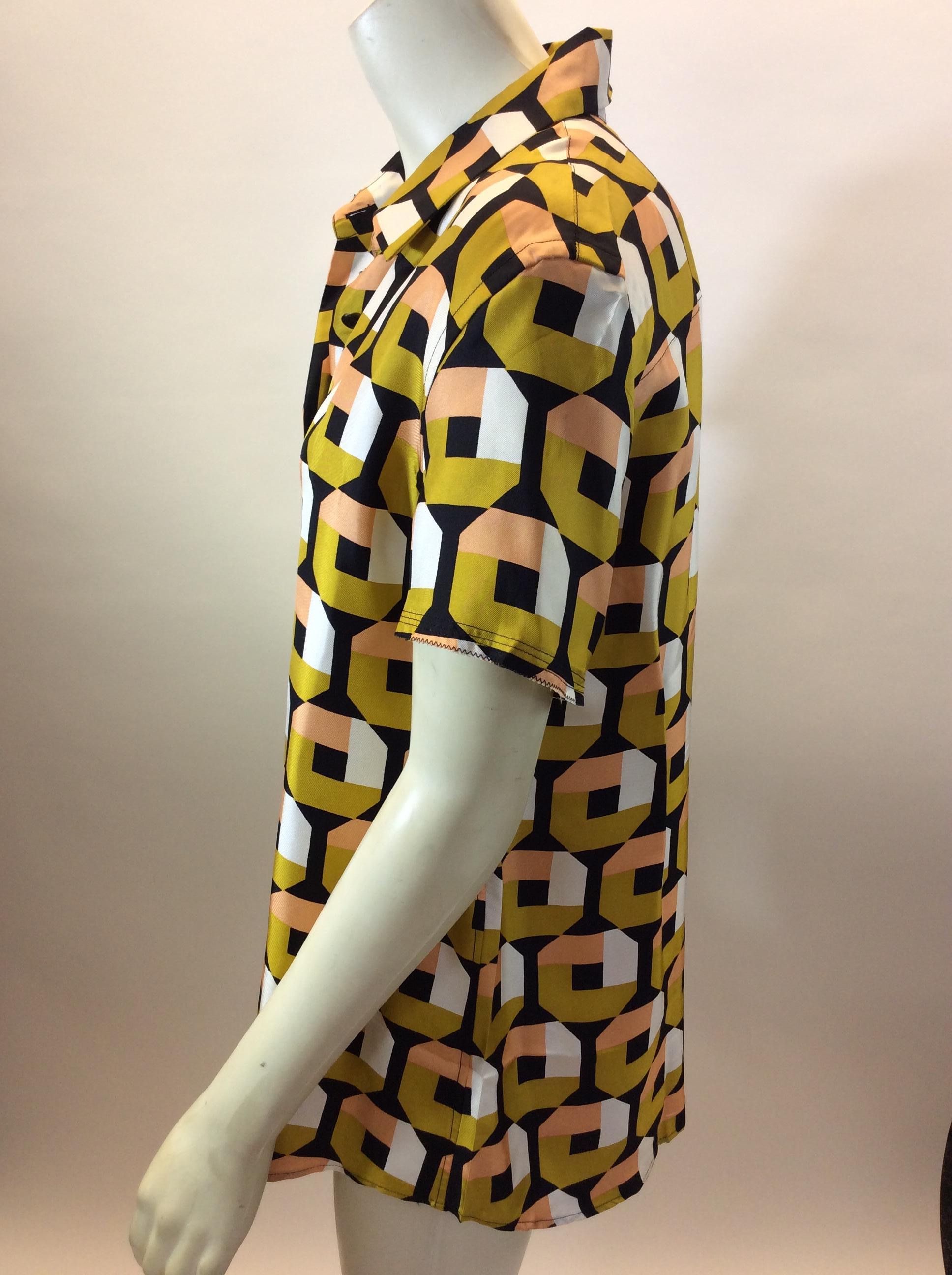 Prada Multi-Color Print Silk Blouse
$150
Made in Italy
100% Silk
Size 44
Length 26