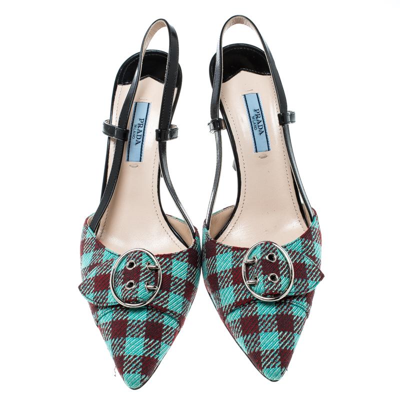 Comfort and fashion join hands and bring forth these gorgeous sandals from Prada! They are crafted from multicoloured check patterned fabric and leather and feature pointed toes, silver-tone buckle detailing on the vamps, comfortable insoles,