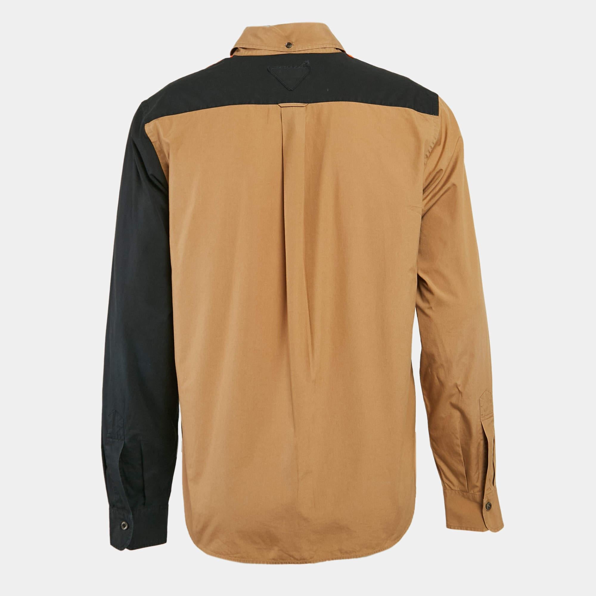 This multicolor shirt from Prada combines urban elements with aesthetics that go beyond space and time. Well made and comfortable  it offers a regular fit and is made using quality cotton. It is adorned with face print and buttoned closure on the