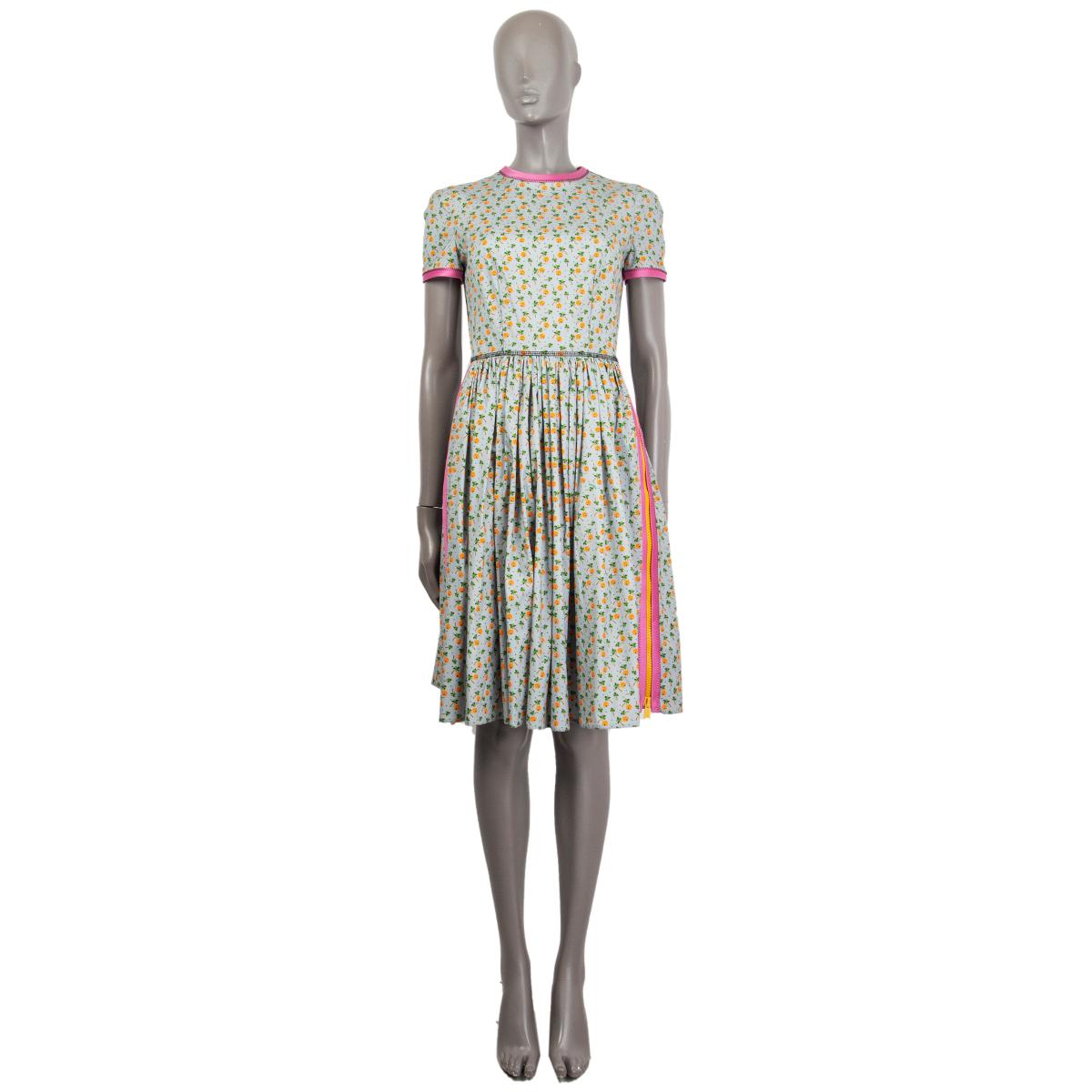100% authentic Prada beach hut and palm trees print dress in multi-color cotton (94%) and elastane (6%) with a round neck and yellow zippers on each sides. Has mulbery contrasting hem fabric details. Closes on the back with a concealed zipper.