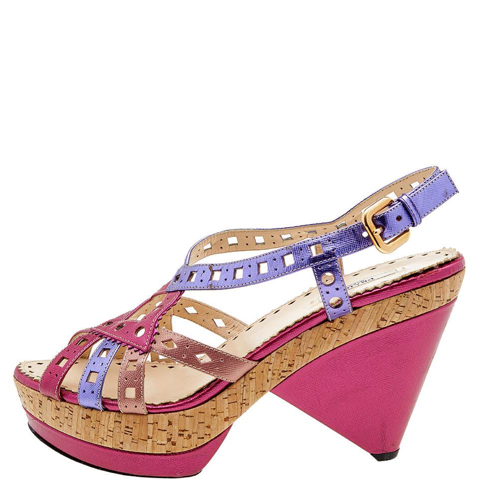 Flaunt perfection as you walk in these sandals from Prada. They are crafted using multicoloured leather on the exterior. They showcase cork heels, platforms, and a buckled slingback. Gold-tone hardware beautifies them. Make a stunning style