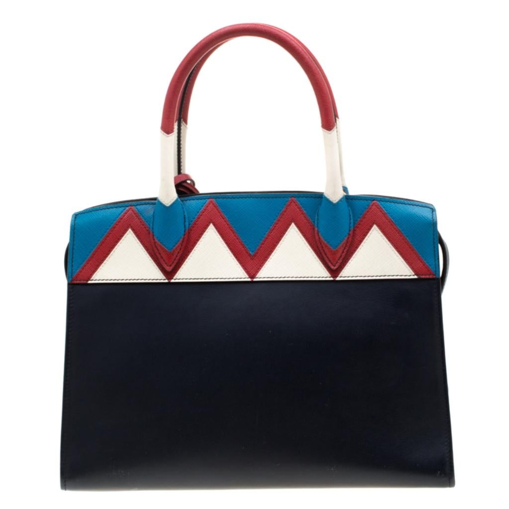This fancy creation by Prada features perfection in all aspects. Its brilliant shape, appealing design and a fine finish has made this bag the ideal purchase of the season. Crafted from leather, this Esplanade Zig Zag tote comes with a well-sized
